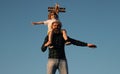 Father and son. Fathers day. Father giving son ride on back. Portrait of father giving son piggyback ride on shoulders Royalty Free Stock Photo