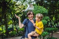 Father and son feeding ibes in the park. Little Egret Cattle egret Bubulcus ibis Waters Edge. Family spends time in the Royalty Free Stock Photo