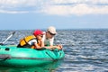 Father and son fish in a boat Royalty Free Stock Photo