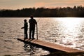 Father and Son Fishing on Pier at the Lake Royalty Free Stock Photo