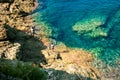 Father and son fishing on ocean coastline