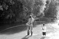 Father and son fishing. Father and son relaxing together. Little boy fishing with father.