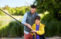 Father and son fishing on river Royalty Free Stock Photo