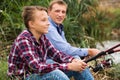 Father and son fishing on river Royalty Free Stock Photo