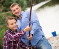 Father and son fishing on river Royalty Free Stock Photo