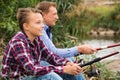 Father and son fishing on river Royalty Free Stock Photo