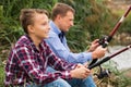 Father and son fishing on river Royalty Free Stock Photo