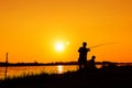 Father and son fishing in the river Royalty Free Stock Photo
