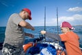 Father and son fishing at sea Royalty Free Stock Photo