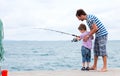 Father and son fishing together Royalty Free Stock Photo