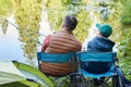 Father and Son Fishing Together by Lake Royalty Free Stock Photo