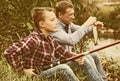 Father and son fishing together on lake Royalty Free Stock Photo