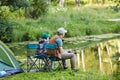 Father and Son Fishing Together by Lake Royalty Free Stock Photo