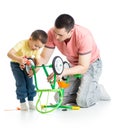 Father and son fixing repairing bicycle wheel