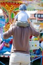 Father and son fun merry go round Royalty Free Stock Photo