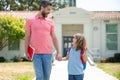 Father and son go to school, education and learning. Parent and pupil of primary school schoolboy with backpack.