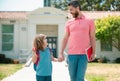 Father and son go to school, education and learning. Parent and pupil of primary school schoolboy with backpack.