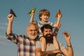 Father son and grandfather playing - family time together. Happy fathers day. Royalty Free Stock Photo