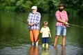 Father, son and grandfather relaxing together. Coming together. I love fishing. Senior man fishing with son and grandson Royalty Free Stock Photo