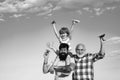 Father son and grandfather relaxing together. Freedom to dream - joyful kid playing with airplane against the sky - Royalty Free Stock Photo