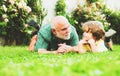 Father son and grandfather relaxing together. Happy family father and child on meadow with a kite in the summer on green Royalty Free Stock Photo