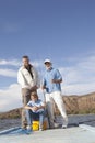 Father, Son And Grandson With Fishing Equipment Royalty Free Stock Photo