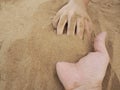 Father and son hands on sand. Close up Royalty Free Stock Photo