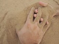 Father and son hands on sand. Close up Royalty Free Stock Photo