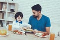 Father and Son Have a Breakfast Royalty Free Stock Photo