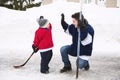 A cool Father and son have fun playing hockey