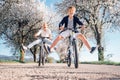 Father and son have a fun when riding bicycles on country road w Royalty Free Stock Photo