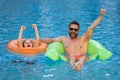 Father and son have fun in swimming pool. Fathers day. Father and son in poolside, summer family. Child with dad playing Royalty Free Stock Photo