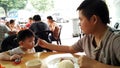 Father and son having breakfast