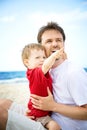 Father and son having fun on the beach. Royalty Free Stock Photo