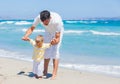 Father and son having fun on beach