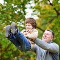 Father and son having fun in a park Royalty Free Stock Photo