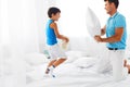 Father and son having fun. Pillow fight Royalty Free Stock Photo