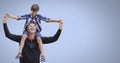 Father and son having fun playing with blue background Royalty Free Stock Photo