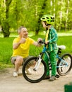 Father and son having fun riding a bike Royalty Free Stock Photo