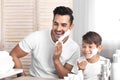 Father and son having fun while shaving Royalty Free Stock Photo