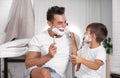 Father and son having fun while shaving Royalty Free Stock Photo