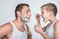 Father and son shaving together Royalty Free Stock Photo