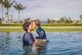 Father and Son having fun in the swimming pool Royalty Free Stock Photo