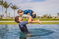 Father and Son having fun in the swimming pool Royalty Free Stock Photo