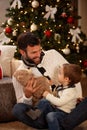 Father with son having fun with teddy bear Royalty Free Stock Photo