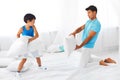 Father and son having a pillow fight Royalty Free Stock Photo
