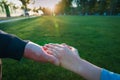 Father and son holding hands at sunset, parenting Royalty Free Stock Photo