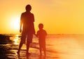 Father and son holding hands at sunset Royalty Free Stock Photo