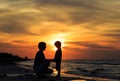 Father and son holding hands at sunset Royalty Free Stock Photo