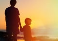 Father and son holding hands at sunset Royalty Free Stock Photo